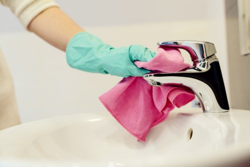 Carpet cleaning technician in Brent preparing equipment safely