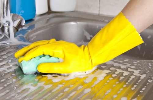 Local cleaners removing renovation dust from kitchen surfaces in Brent