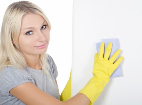 Routine domestic cleaning in a Brent flat with organized living space